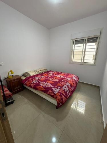 Postel nebo postele na pokoji v ubytování Aziza Tanjaouia