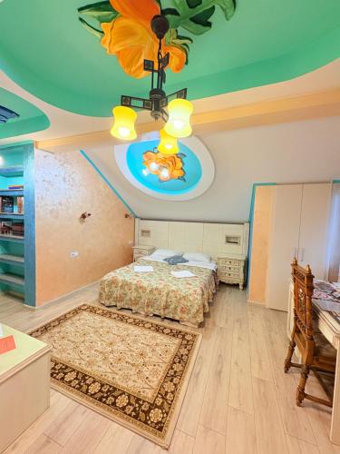 a bedroom with a bed and a ceiling at Presidential Apartment in Suceava