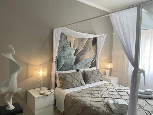 Postel nebo postele na pokoji v ubytování Al Politeama Rooms B&B