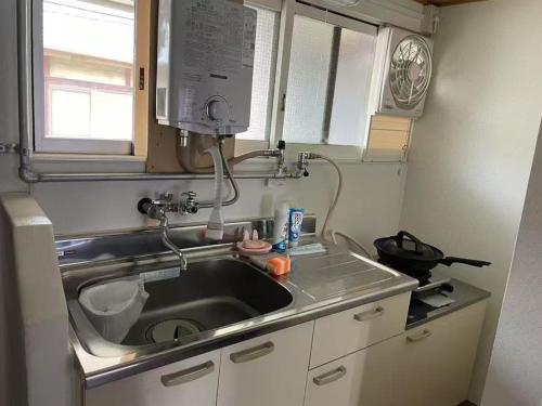 Η κουζίνα ή μικρή κουζίνα στο Autumn Leaves Villa 203