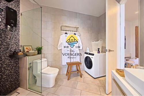 a bathroom with a toilet and a washing machine at Sea Park LeSu 8 The Shore KK I 1 plus 1 Room 2-5 Pax 홈스테이 in Kota Kinabalu