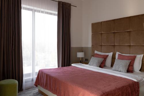 Postel nebo postele na pokoji v ubytování Mountain View Boutique Hotel