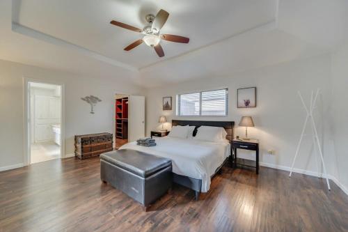 a bedroom with a bed and a ceiling fan at Central Plano 4-BD 2-BA Pool Retreat, Sleeps 10 in Plano