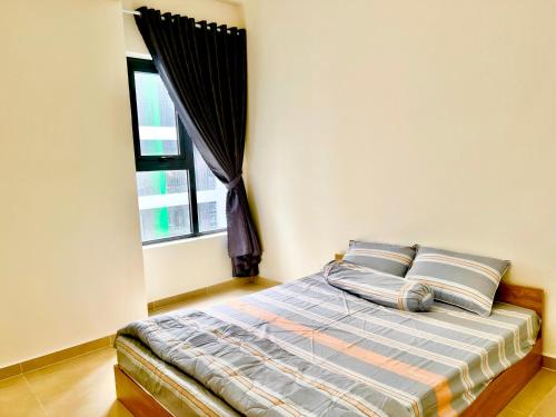 Giường trong phòng chung tại Mai Home in Ho Chi Minh