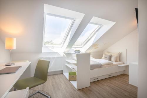 Ένα ή περισσότερα κρεβάτια σε δωμάτιο στο Candlewood Suites Fürth by IHG