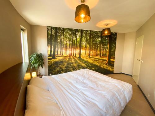 En eller flere senge i et værelse på Luxe vakantiehuis Drenthe 10 pers Hottub