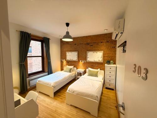 Ένα ή περισσότερα κρεβάτια σε δωμάτιο στο Auberge du Plateau