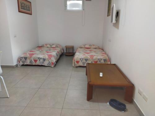 Ένα ή περισσότερα κρεβάτια σε δωμάτιο στο R. & M. RELAX Appartamento con giardino, barbecue