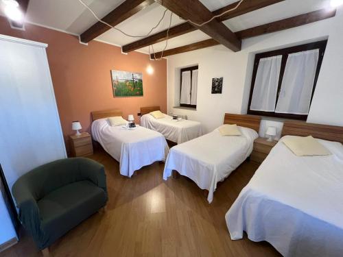 Ένα ή περισσότερα κρεβάτια σε δωμάτιο στο Tenuta Roletto