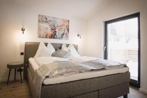 Ένα ή περισσότερα κρεβάτια σε δωμάτιο στο MountainLodge am Ötscher