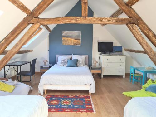 Postel nebo postele na pokoji v ubytování La gourmandière aux bruyères