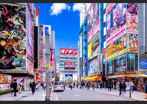 a busy street in a city with many buildings at SUZUNONE Entire House Tatami Shoji,2 min walk natural hot springs near BIG super market ASAKUSA AKIHABARA SKYTREE nearby in Tokyo