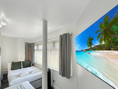 a bedroom with a view of the beach at Granada Apartments Holmfield Rd in Blackpool