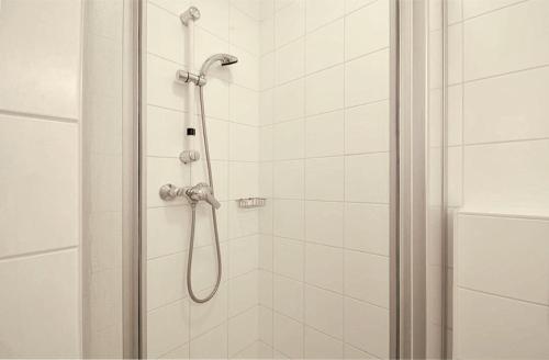 a bathroom with a shower with a glass door at Kitzsteinhorn Kaprun Panorama in Dürnberg
