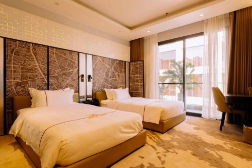 a hotel room with two beds and a piano at X-Digital HOTEL in Bắc Ninh