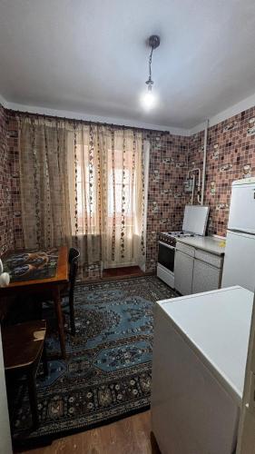 Kuchyň nebo kuchyňský kout v ubytování Apartament