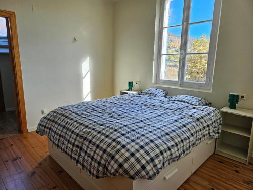 Ένα ή περισσότερα κρεβάτια σε δωμάτιο στο Casa familiar con encanto