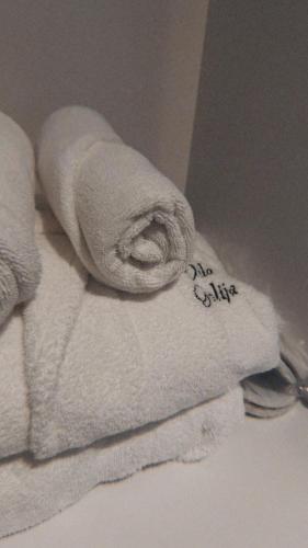 a pile of towels sitting on a pile of towels at Vila Golija Peak Suites in Kopaonik