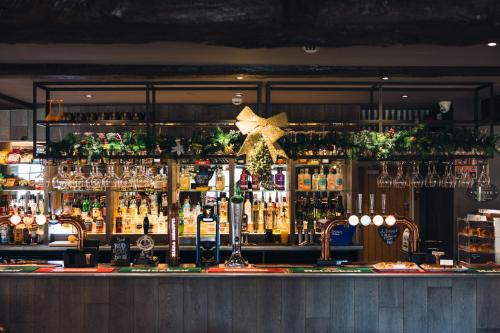 a bar with a lot of bottles of alcohol at The Station Restaurant & Bar in Doncaster