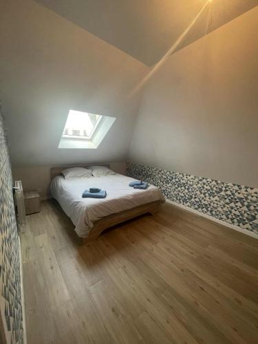 Ένα ή περισσότερα κρεβάτια σε δωμάτιο στο Appart bourg