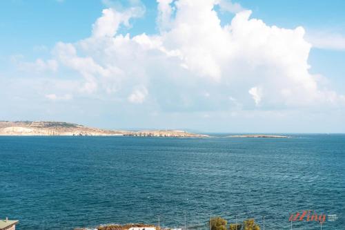 a view of a large body of water at A Stylish Seaside Holiday Home in St Paul's Bay in St. Paul's Bay