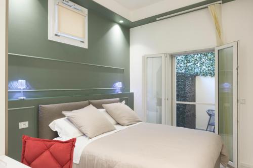 Ένα ή περισσότερα κρεβάτια σε δωμάτιο στο Reggio Charme