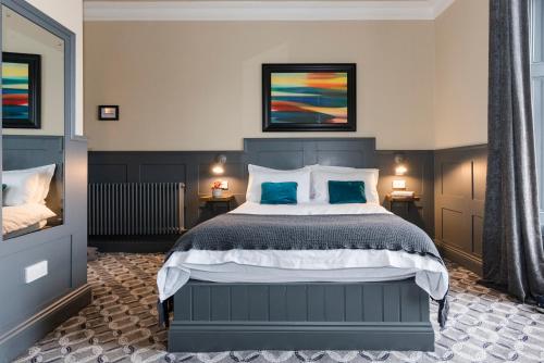 Ένα ή περισσότερα κρεβάτια σε δωμάτιο στο Irvine Guest House