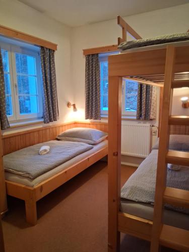 Ένα ή περισσότερα κρεβάτια σε δωμάτιο στο Penzion Zákoutí Deštné v Orlických horách