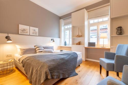 Una cama o camas en una habitación de Logierhaus K15 Appartement 3