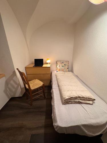 Ένα ή περισσότερα κρεβάτια σε δωμάτιο στο La volta delle Dolomiti