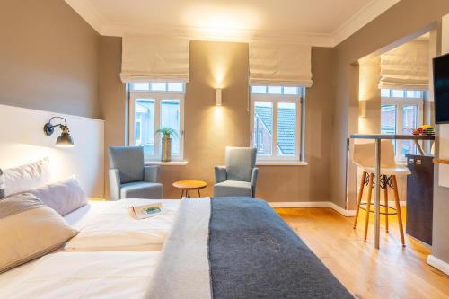 Una cama o camas en una habitación de Logierhaus K15 Appartement 10