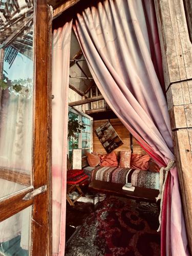 a bed in a room with a window at Al Aire Libre in San Rafael