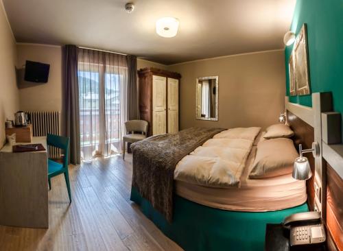 Ліжко або ліжка в номері Hotel Lyskamm