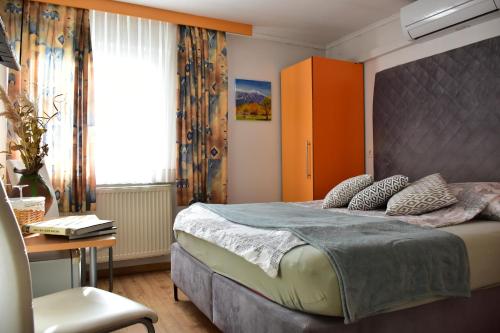 Ένα ή περισσότερα κρεβάτια σε δωμάτιο στο Sobe - Rooms Stremljan Ljubljana