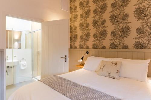 Ένα ή περισσότερα κρεβάτια σε δωμάτιο στο Irvine Bay