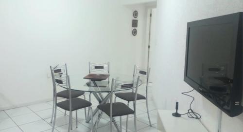 Et tv og/eller underholdning på Apartamento Pruner Meia Praia