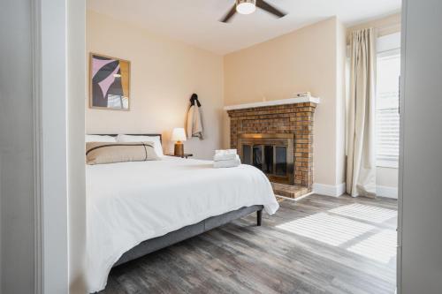 a bedroom with a bed and a fireplace at Outsite San Diego - Golden Hill in San Diego