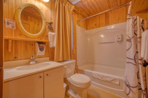 a bathroom with a toilet and a sink and a shower at Chalet Aigle 7 min to SPA for 16 Guests , Skiing in Saint-Paul-de-Montminy