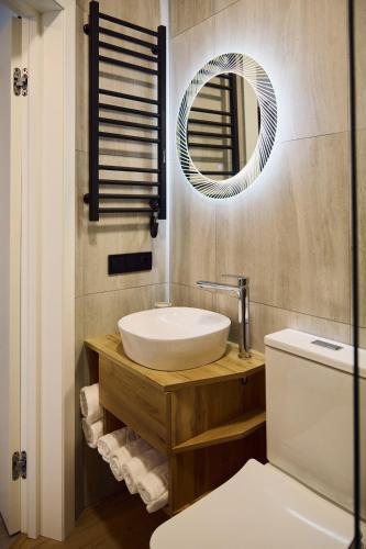 a bathroom with a sink and a mirror at Monte Blu in Migovo