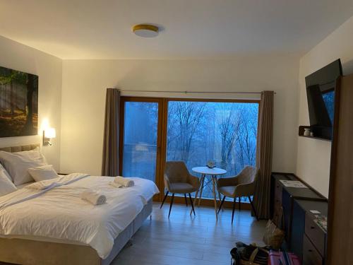 Ένα ή περισσότερα κρεβάτια σε δωμάτιο στο Szent László Residence