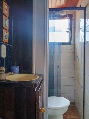 a bathroom with a sink and a toilet at Refugio de Mar in Búzios