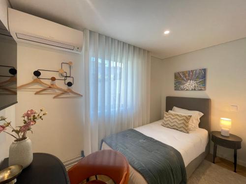 En eller flere senge i et værelse på MyStay Porto Urban Park