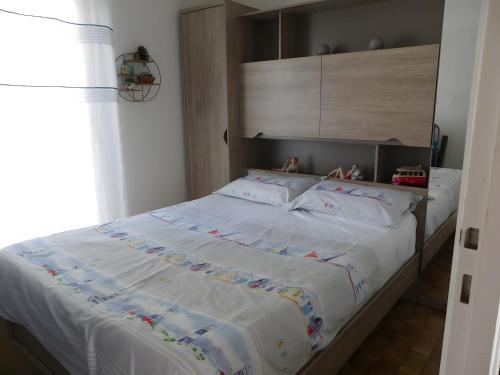 En eller flere senge i et værelse på Le Repos Marin