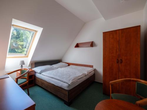 Ένα ή περισσότερα κρεβάτια σε δωμάτιο στο Depandance - vedlejší budova u Zámku Třešť