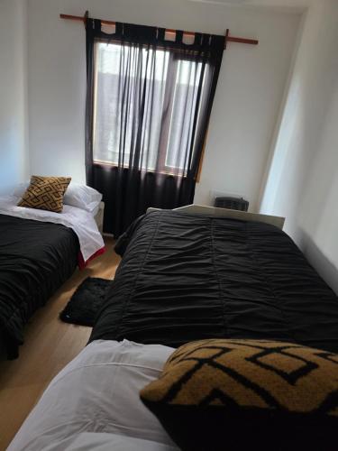 Postel nebo postele na pokoji v ubytování Temporario RG