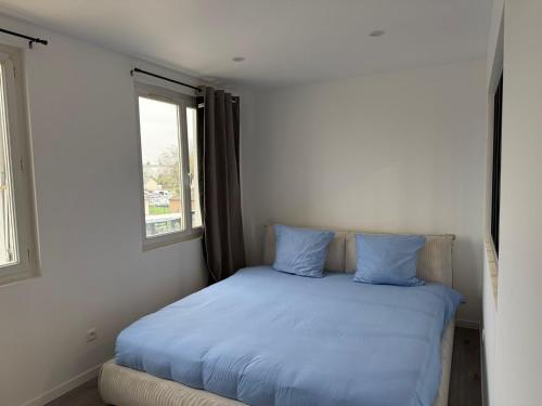 Ένα ή περισσότερα κρεβάτια σε δωμάτιο στο Le Prestige - T2 Neuf et Equipé