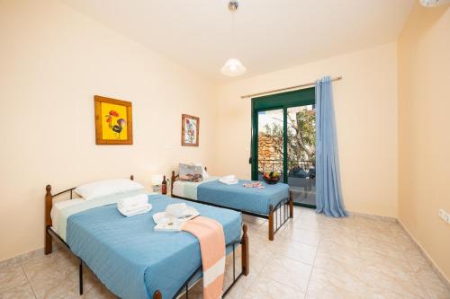 Ένα ή περισσότερα κρεβάτια σε δωμάτιο στο Villa Iris