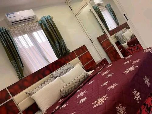 Llit o llits en una habitació de Résidence Bonheur