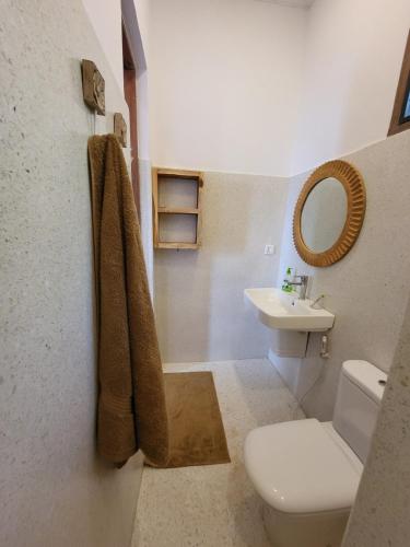 a bathroom with a toilet and a sink at Hondo Hondo mountain view in Lushoto