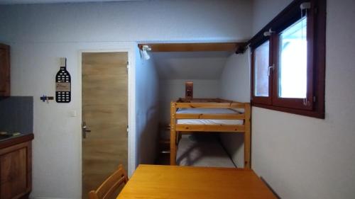 Ένα ή περισσότερα κρεβάτια σε δωμάτιο στο Studio 4 personnes pied des pistes